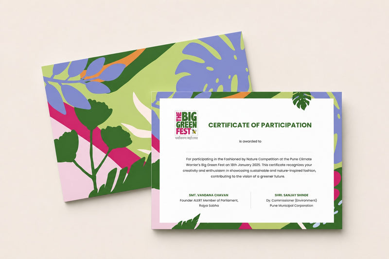 A certificate of participation card with a white center and colorful tropical leaf border, placed in front of a matching printed card on a light beige background.